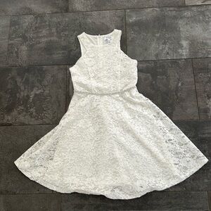 Girls beautiful sparkly white dress with a bejeweled waist.